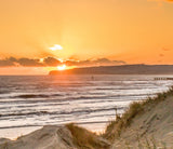 orange sunset in the dunes at camber